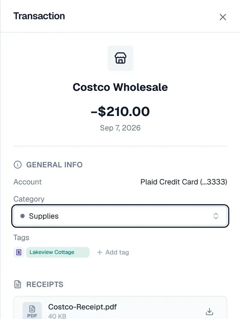 A $210.00 Costco Wholesale charge from Sep 7, 2026, on a credit card, filed as Supplies and tagged Lakeview Cottage. Under Receipts, a file named Costco-Receipt.pdf, 40 KB, with a download button.